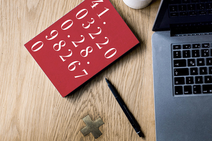 red notebook and pen